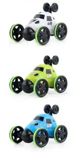 Vertical stack of three colorful stunt toy cars in white, green, and blue with large wheels