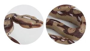Macro detail of realistic python toy showing intricate scale texture and red eyes