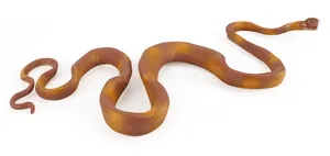 Detailed view of realistic toy snake with scales texture and orange brown patterns