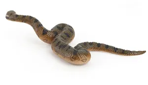 Detailed view of realistic green anaconda toy with textured scales and circular pattern