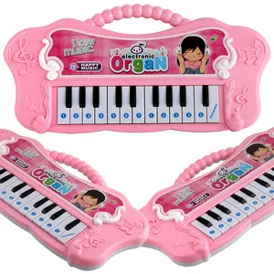 Pink 13-key musical electronic keyboard toy for kids featuring girl cartoon and function button