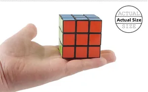 Standard 3x3 speed cube held in hand showing the actual size and colorful stickers