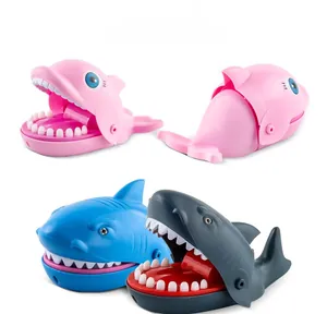Detail showing colorful shark and dolphin biting finger toys with smooth plastic teeth