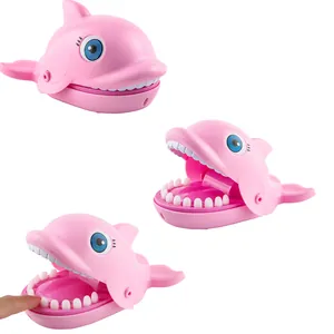 Pink dolphin biting finger game toy showing open mouth and pressing teeth action
