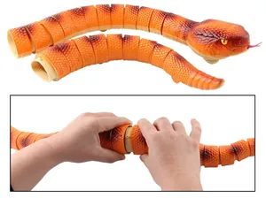 Detail of orange infrared remote control snake showing modular segments and assembly
