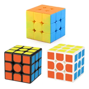 Three 3x3x3 speed cubes in frosted stickerless, black and white sticker finishes