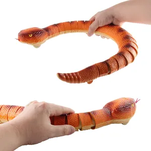 Realistic remote control rattlesnake toy with flexible segmented orange body and yellow eyes