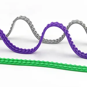 Flexible silicone building block baseplate strips compatible with small bricks in three colors