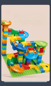 Detailed close-up of colorful DIY marble run tracks with emoji balls and bright brick pieces
