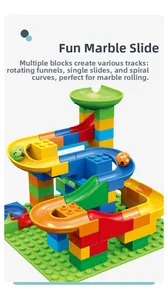 Close-up of colorful marble run track components including funnels and curves