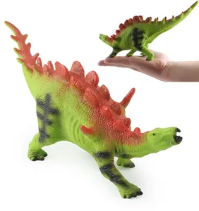 Macro view of green Stegosaurus toy set showing skin texture and size comparison