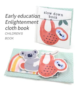 Close-up of soft baby cloth book with 3D tactile textures and sloth rainbow illustrations