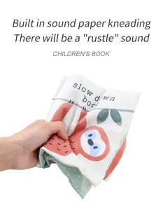 Detail of crinkle cloth book showing soft fabric and internal sound paper for infant tactile play