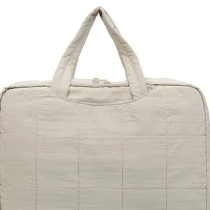 Minimalist beige quilted nylon laptop tote bag with sturdy top handles and dual zipper