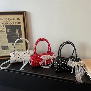 French vintage polka dot cylinder bags in white red and black with lace bows and pearls