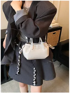 Detail of off-white retro tote bag featuring lychee texture and detachable shoulder strap