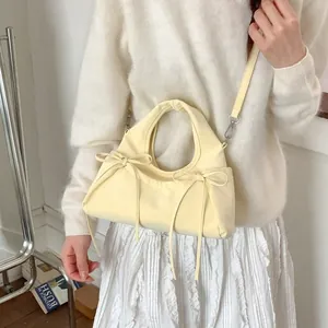Cream yellow pleated bow shoulder bag for women with soft leather and adjustable strap