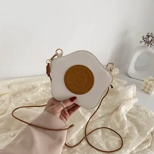 Creative fried egg shaped crossbody bag with Stay Fresh leather patch and rope strap