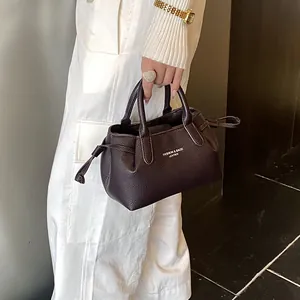 Deep brown lychee pattern leather tote bag with stylish top handles and side drawstring