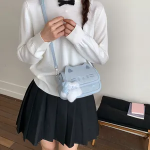 Light blue cartoon cat crossbody bag with 3D ears and plush charm in college style