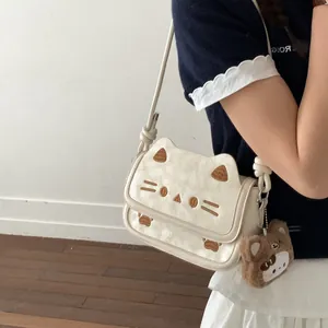 Cute white cartoon cat crossbody bag for women with embroidery and plush charm decoration
