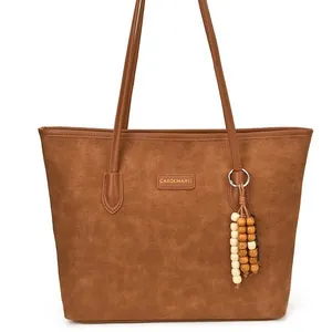 Brown faux leather tote bag with embossed puppy pattern and decorative wooden beads