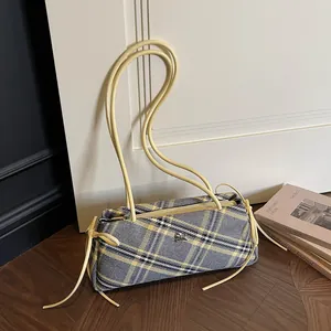 Classic yellow and grey plaid underarm bag with silver knight logo and leather straps