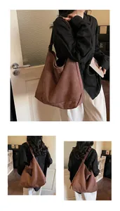Detail view of large mocha brown suede tote bag showing its spacious interior for commuting
