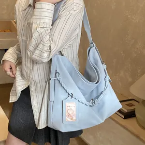 Light blue large capacity tote bag with woven chain and adjustable shoulder strap