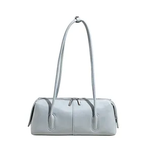 Minimalist light blue baguette shoulder bag in premium leather with silver zippers