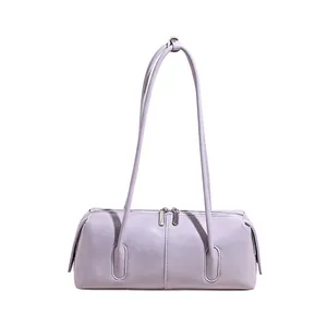 Close-up of minimalist light purple baguette bag with silver double zippers and slim straps