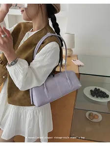 Minimalist purple baguette shoulder bag shown as part of a stylish vintage outfit