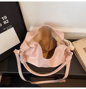 Top view of pink faux leather tote bag interior showing spacious lining and zipper pocket