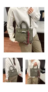 Detailed views of a dark green suede handbag with silver metal clasp and dog charm