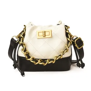 Mini sac seau matelassé bicolore noir et blanc avec chaîne dorée pour femmes et enfants
