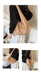 Detail of light tan hobo bag featuring premium pebble grain texture and seamless strap design