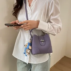 Lavender purple pebble grain bucket bag with cute bear charm and adjustable strap