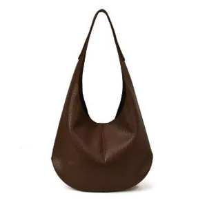 Brown pebble leather hobo shoulder bag with spacious interior and minimalist style