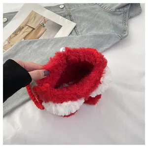 Detail of red and white faux fur crossbody bag featuring large pearl clasp and woven strap