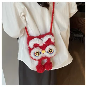Detail of red knit lion dance crossbody bag showing festive handmade plush texture