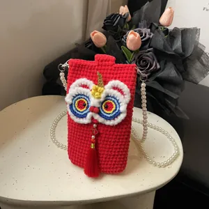 Knitted red lion dance crossbody bag with pearl strap and traditional lucky tassel