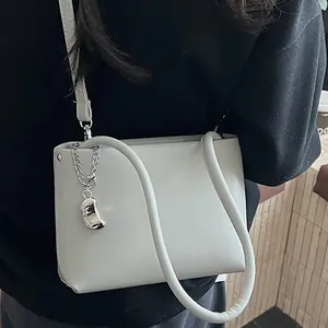 Minimalist light grey leather bucket shoulder bag with silver chain detail for women