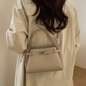 Chic beige lychee leather small square bag with silver clasp and adjustable shoulder strap