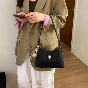 Minimalist black lychee pattern shoulder bag with silver buckle and plush charm for women