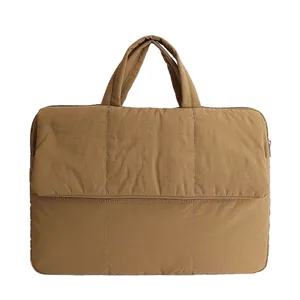 Quilted khaki laptop handbag with padded fabric and top handles for business commuting