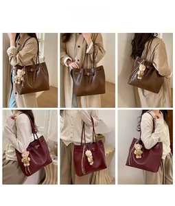 Lifestyle view of high-capacity faux leather tote bag with elegant styling and plush charm