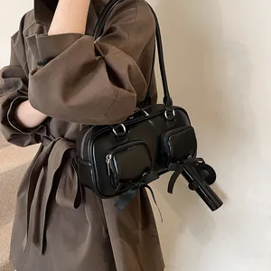 Minimalist black PU leather Boston tote with bow ribbons and multi-pocket design