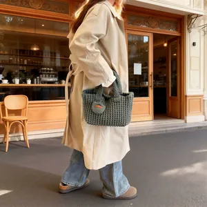 Handmade woven knit handbag in dark green with heart charm and Hand Made leather label