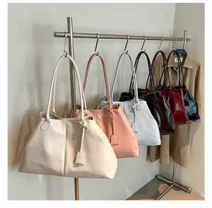 Close-up of assorted large capacity tote bags in multiple colors with smooth finish