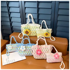 Detailed close-up of handmade crochet bucket bags in three floral patterns and two sizes